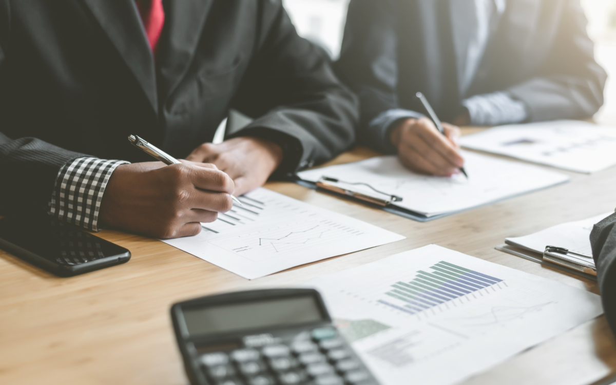 Accountants creating Graphs on Paper